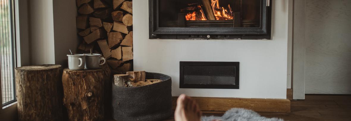 Feet near a fireplace 