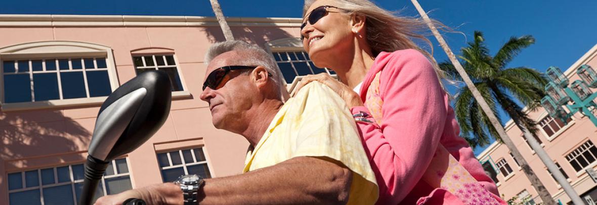 Mature couple on a scooter