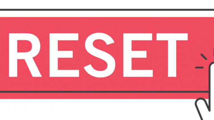 illustration of a hand pressing a red reset button