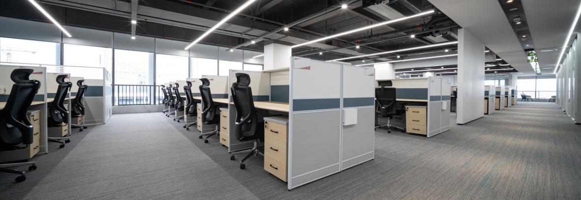 office space with rows of empty desks