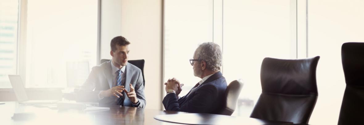 Businessmen talking at table