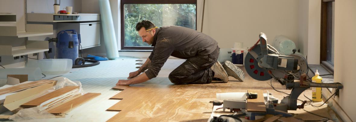 Man installing hardwood floors