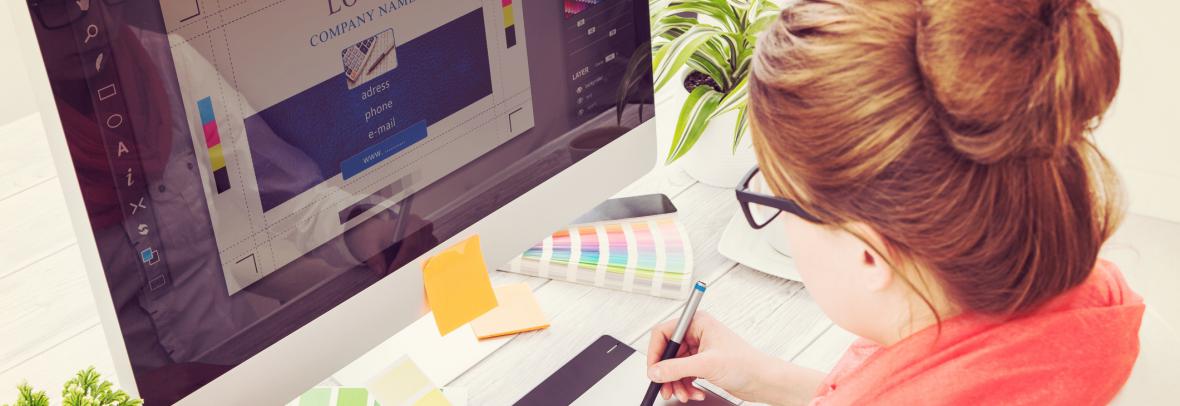 Woman looking at color palette and computer